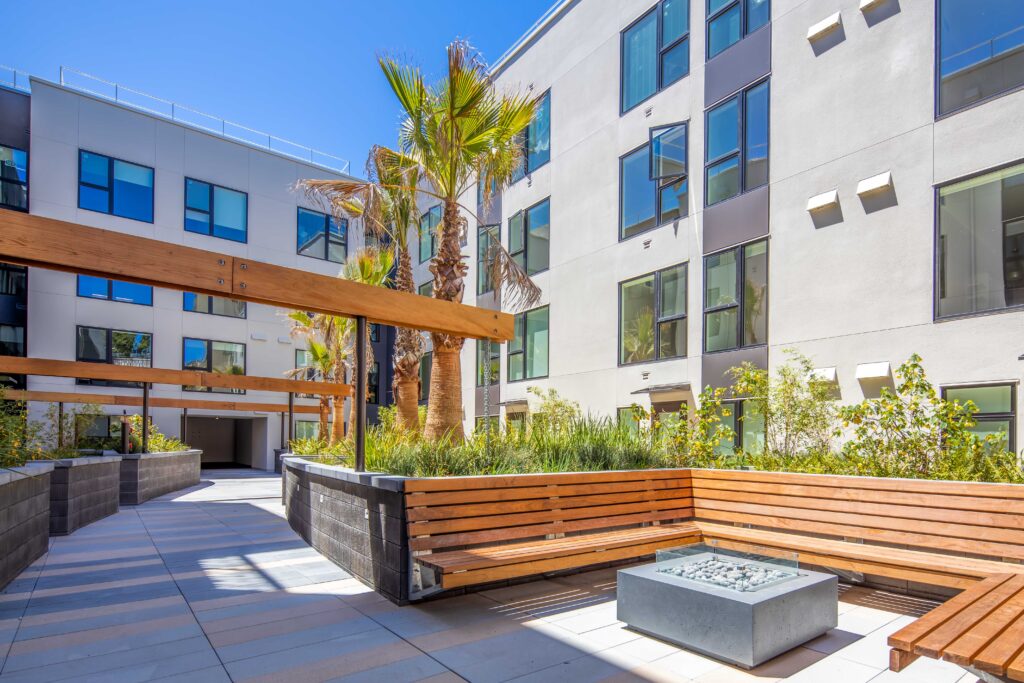 Couryard with beautiful landscaping and modern wood benches